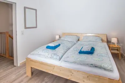 Ein Bett oder Betten in einem Zimmer der Unterkunft Ferienhäuser Ilsestein Doppelhaus, 100 qm, 3 Schlafzimmer