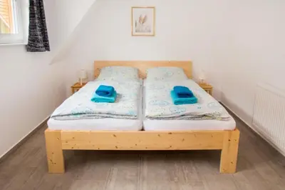 Ein Bett oder Betten in einem Zimmer der Unterkunft Ferienhäuser Ilsestein Doppelhaus, 100 qm, 3 Schlafzimmer