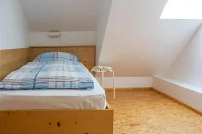 Ein Bett oder Betten in einem Zimmer der Unterkunft Ferienwohnung Ferienhäuser am Brocken, 80 qm 3 Schlafzimmer