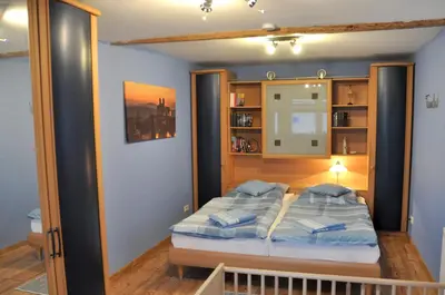 Ein Bett oder Betten in einem Zimmer der Unterkunft Ferienhaus Am Mühlenberg Thale Westerhausen