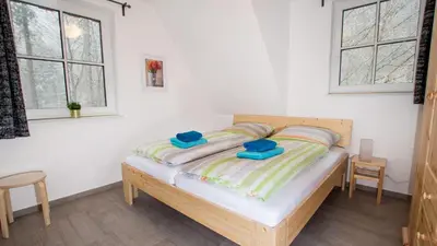 Ein Bett oder Betten in einem Zimmer der Unterkunft Ferienhäuser Ilsestein Einzelhaus, 130 qm, 4 Schlafzimmer