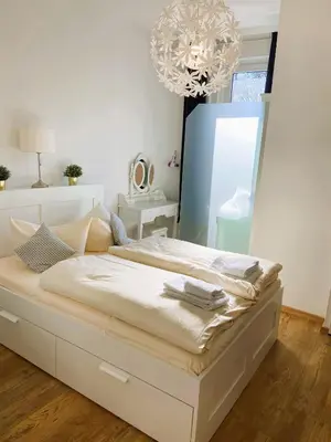 Ein Bett oder Betten in einem Zimmer der Unterkunft Peters Aparthotel