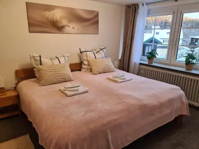 Ein Bett oder Betten in einem Zimmer der Unterkunft Ferienwohnung Rieger 2