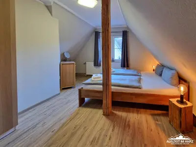 Ein Bett oder Betten in einem Zimmer der Unterkunft Auszeit-im-Harz Haus 1 Wohnung Brockenspitze