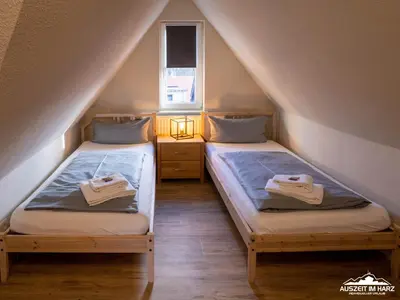 Ein Bett oder Betten in einem Zimmer der Unterkunft Auszeit-im-Harz Haus 1 Wohnung Brockenspitze