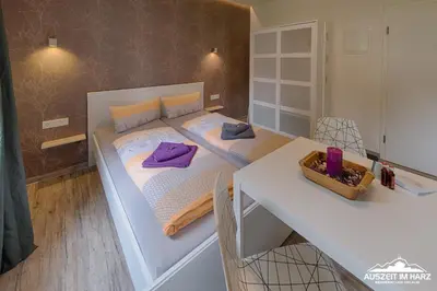 Ein Bett oder Betten in einem Zimmer der Unterkunft Auszeit-im-Harz Haus 2 Wohnung 2