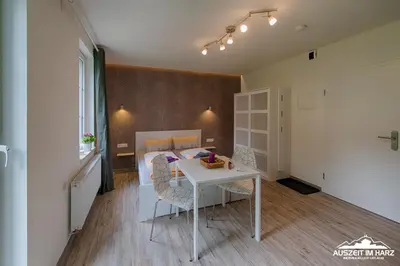 Ein Bett oder Betten in einem Zimmer der Unterkunft Auszeit-im-Harz Haus 2 Wohnung 2