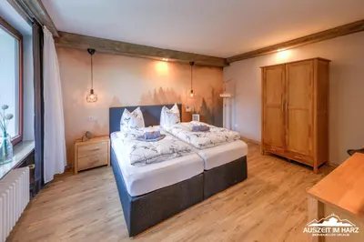 Ein Bett oder Betten in einem Zimmer der Unterkunft Auszeit-im-Harz Haus 3 Wohnung 2