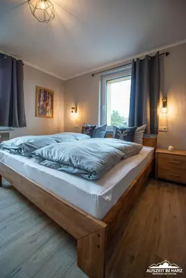 Ein Bett oder Betten in einem Zimmer der Unterkunft Auszeit-im-Harz Haus 3 Wohnung 3