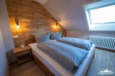 Ein Bett oder Betten in einem Zimmer der Unterkunft Auszeit-im-Harz Haus 3 Wohnung 7