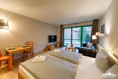 Ein Bett oder Betten in einem Zimmer der Unterkunft Auszeit-im-Harz Haus 5 Wohnung 11