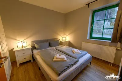 Ein Bett oder Betten in einem Zimmer der Unterkunft Auszeit-im-Harz Haus 5 Wohnung 12