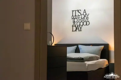 Ein Bett oder Betten in einem Zimmer der Unterkunft Auszeit-im-Harz Haus 6 Ferienhaus