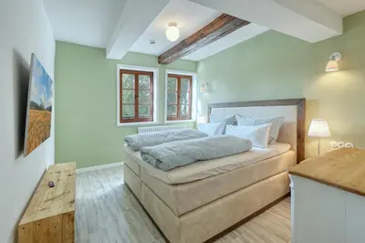 Ein Bett oder Betten in einem Zimmer der Unterkunft Ferienwohnungen Steinweg 61