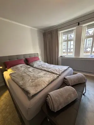 Ein Bett oder Betten in einem Zimmer der Unterkunft Ambiente am Breiten Tor Apartment 1