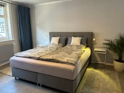 Ein Bett oder Betten in einem Zimmer der Unterkunft Ambiente am Breiten Tor Apartment 2