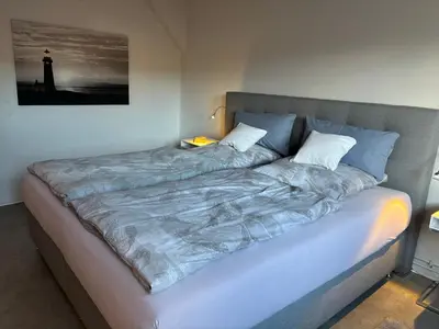 Ein Bett oder Betten in einem Zimmer der Unterkunft Ambiente am Breiten Tor Apartment 2