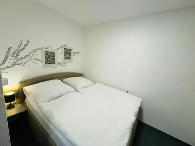 Ein Bett oder Betten in einem Zimmer der Unterkunft FeWo Glockenberg im Ferienpark Altenau