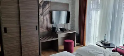 Ein Bett oder Betten in einem Zimmer der Unterkunft Central Hotel & Lounge Adult Only