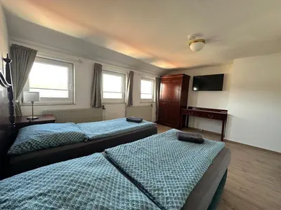 Ein Bett oder Betten in einem Zimmer der Unterkunft Gästehaus am Harz