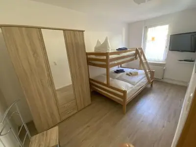 Ein Bett oder Betten in einem Zimmer der Unterkunft Holiday apartment on the Anger