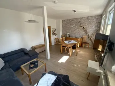 Ein Sitzbereich in der Unterkunft Holiday apartment on the Anger