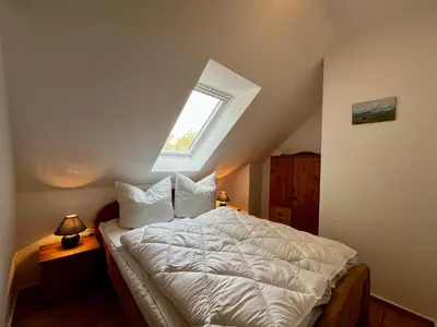 Ein Bett oder Betten in einem Zimmer der Unterkunft JS Feriendomizile: Fewo Hirschwechsel