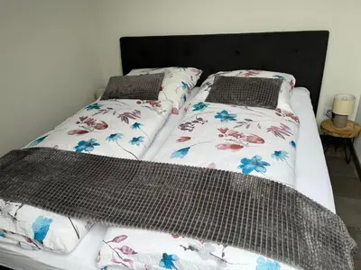 Ein Bett oder Betten in einem Zimmer der Unterkunft International 7