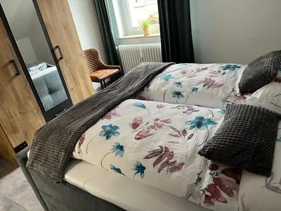 Ein Bett oder Betten in einem Zimmer der Unterkunft International 7