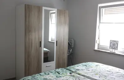 Ein Bett oder Betten in einem Zimmer der Unterkunft Ferienwohnung Gundermann