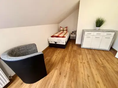 Ein Bett oder Betten in einem Zimmer der Unterkunft FeWo Füchse Braunlage I Verwaltung und Betreuung durch FIRMA ZZ-Braunlage