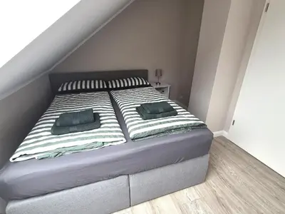 Ein Bett oder Betten in einem Zimmer der Unterkunft Bergliebe