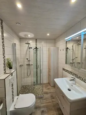 Ein Badezimmer in der Unterkunft Bergzauber Apartment mit Pool, Sauna, Balkon und Panoramablick
