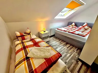 Ein Bett oder Betten in einem Zimmer der Unterkunft FeWo Ferien-Füchse ZZ-BRAUNLAGE