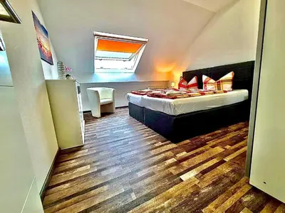 Ein Bett oder Betten in einem Zimmer der Unterkunft FeWo Ferien-Füchse ZZ-BRAUNLAGE
