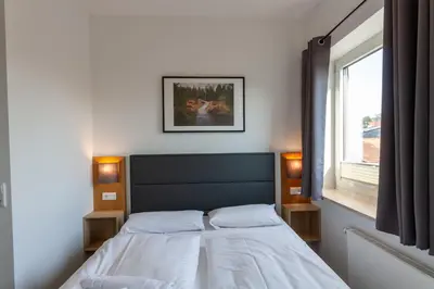 Ein Bett oder Betten in einem Zimmer der Unterkunft Fewo WurmbergLaune - nur 350 m zur Wurmbergseilbahn
