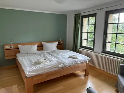 Ein Bett oder Betten in einem Zimmer der Unterkunft Kloster Huysburg Ekkehard Haus