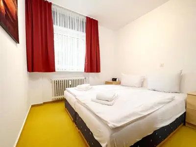 Ein Bett oder Betten in einem Zimmer der Unterkunft Ferienwohnung Harzer Kleinod