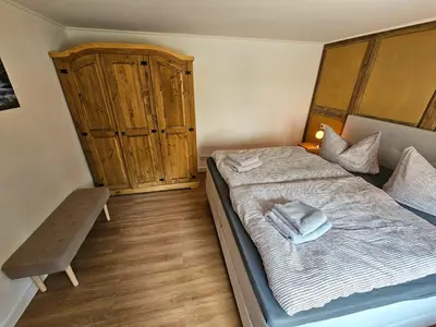 Ein Bett oder Betten in einem Zimmer der Unterkunft Kleine Bergstraße 2 - Haus 2