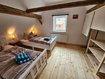 Ein Bett oder Betten in einem Zimmer der Unterkunft Kleine Bergstraße 2 - Haus 2