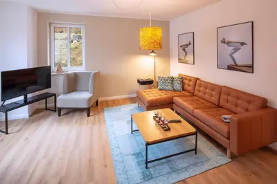 Ein Sitzbereich in der Unterkunft Plumbohms Haus Looges