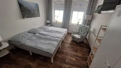 Ein Bett oder Betten in einem Zimmer der Unterkunft Pauls Hexenhaus Wohnung Teufel mit Familienbett