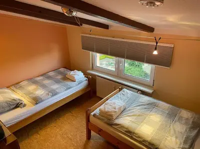 Ein Bett oder Betten in einem Zimmer der Unterkunft Quartier für vier