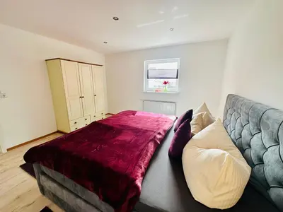 Ein Bett oder Betten in einem Zimmer der Unterkunft Lous Ferienwohnung