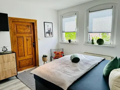 Ein Bett oder Betten in einem Zimmer der Unterkunft Lous Ferienhaus 1