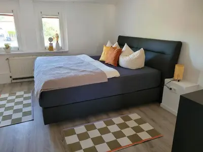 Ein Bett oder Betten in einem Zimmer der Unterkunft Lous Ferienhaus 2