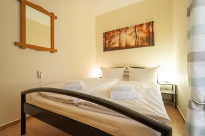 Ein Bett oder Betten in einem Zimmer der Unterkunft Ferienwohnung Harzreise