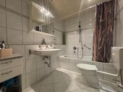 Ein Badezimmer in der Unterkunft De Winter