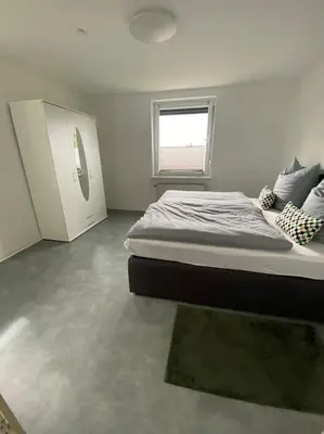 Ein Bett oder Betten in einem Zimmer der Unterkunft Haus PANORAMA - Appartement Auszeit 1