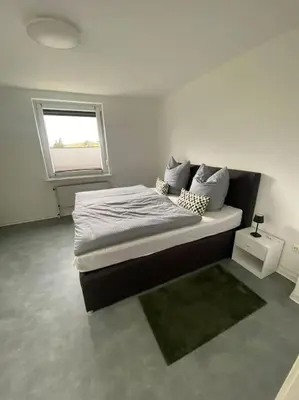 Ein Bett oder Betten in einem Zimmer der Unterkunft Haus PANORAMA - Appartement Auszeit 1